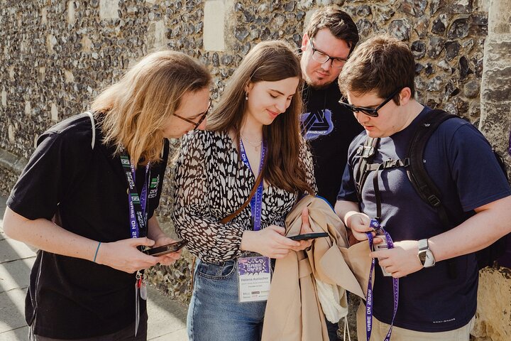 Players using phones to solve puzzles in Canterbury streets
